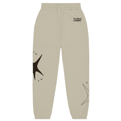 Beige sweatpants with star designs and text on a white background